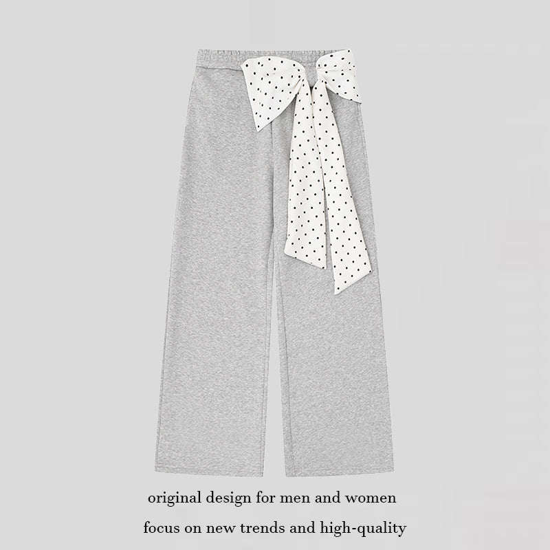 Women's culotte joggers with wide legs and decorative polka dot bow detail