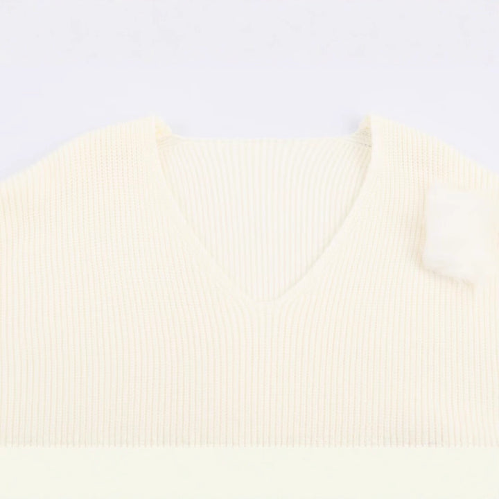 Ladies fine knit mini dress with deep V-neckline and layered faux fur sleeves Mune Fashion