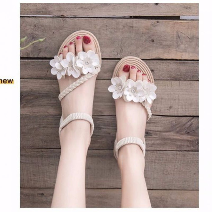 Women's playful strap sandal with braided decorative bands, flower appliqués, and elastic heel strap Mune Fashion