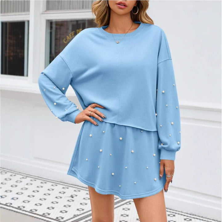Ladies nan pearl-embellished sweat set with oversized sweater and flared mini skirt Mune Fashion