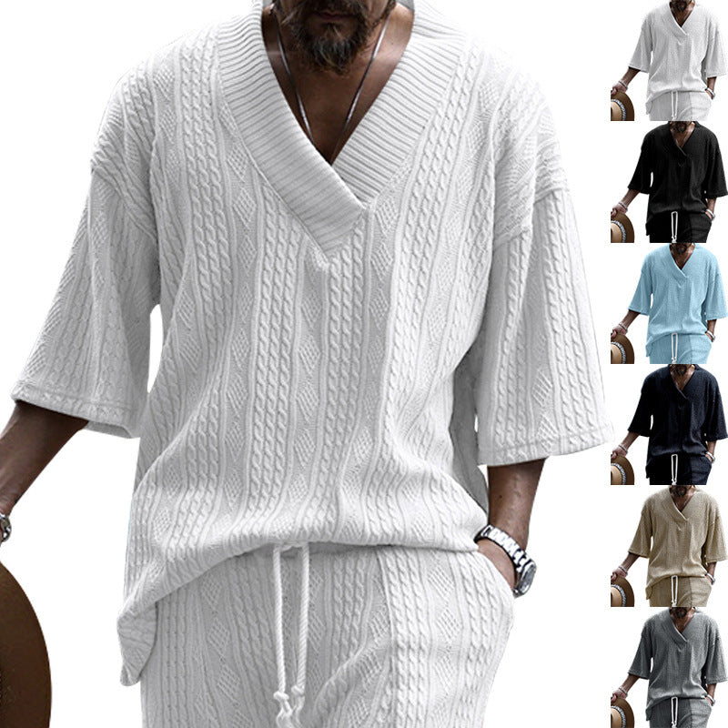 Women's short-sleeve knitted sweater in a loose fit with deep V-neck and cable pattern Mune Fashion