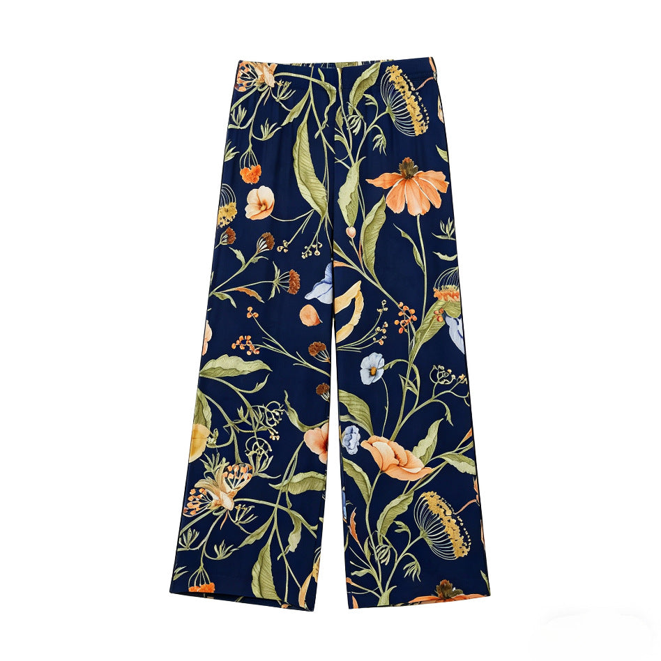 Women's wide high-waisted satin pants with floral all-over print and elastic waistband Mune Fashion