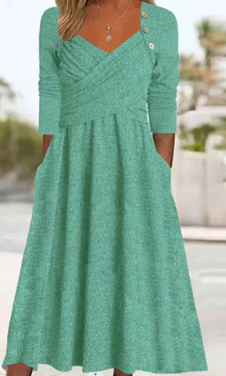 Women's knitted maxi dress with wrap top V-neck, side pockets and decorative button placket Mune Fashion