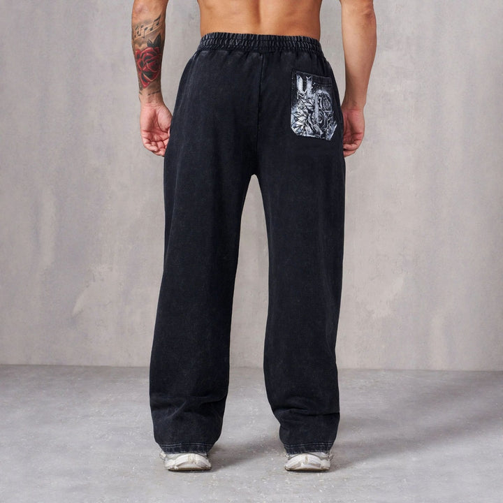 Men's baggy joggers with elastic waistband, side pockets and detailed skull and rose motif Mune Fashion