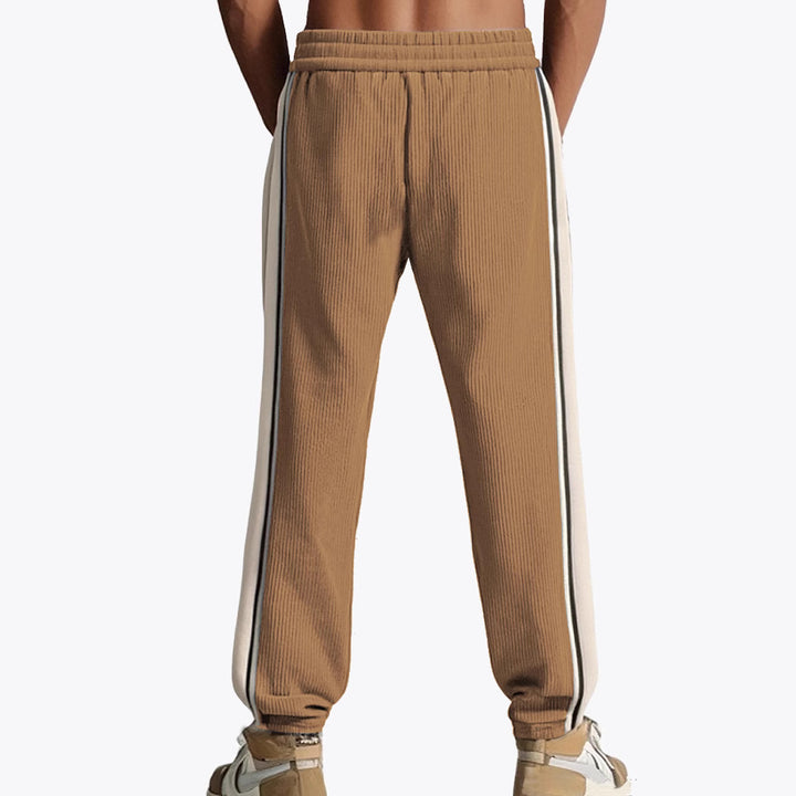 Men's loose training pants in corduroy look with drawstring waistband and side contrast stripes Mune Fashion