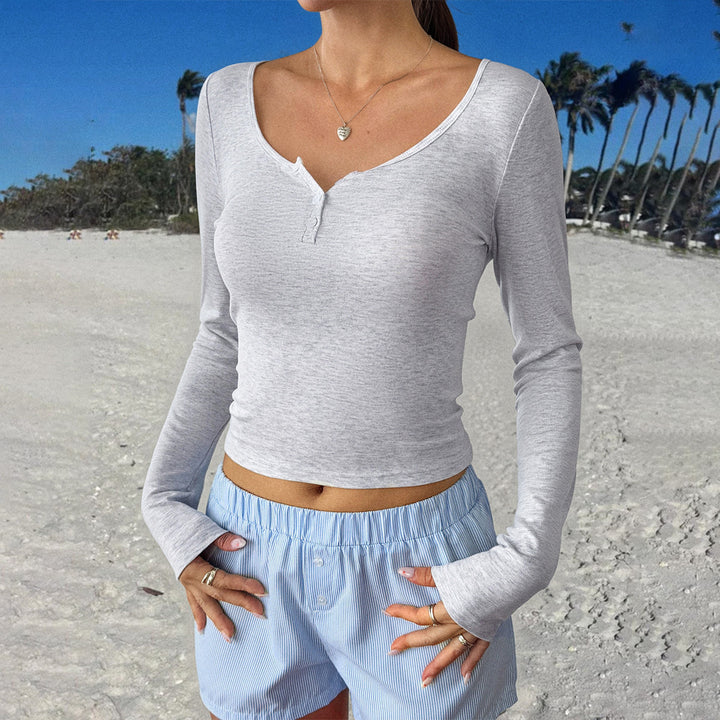 Women's fitted Henley long-sleeve shirt with deep U-neck, fine ribbed texture, and decorative button placket Mune Fashion