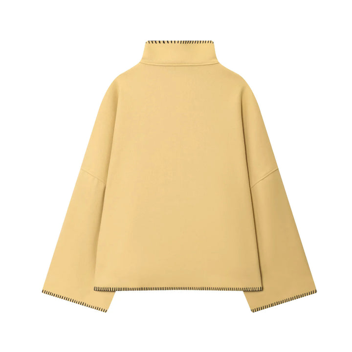 Ladies oversized wool cape jacket with high collar and asymmetrical button placket Mune Fashion