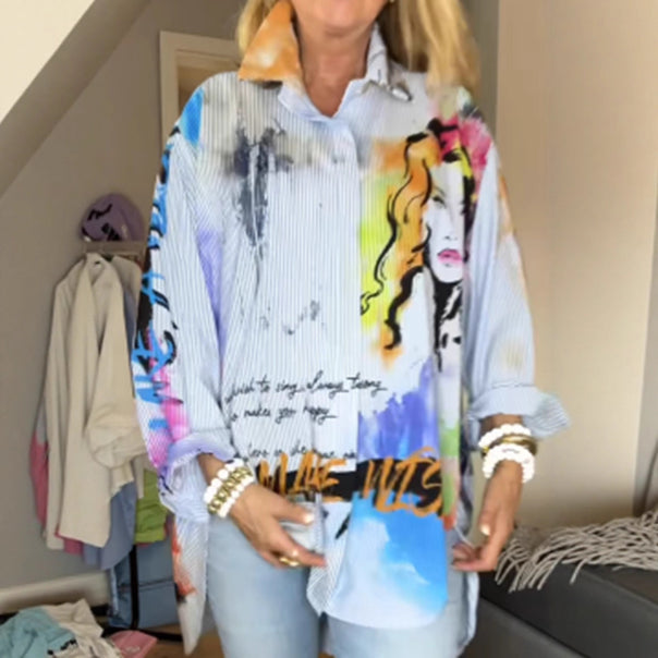 Ladies loose-fitting shirt blouse with artistic graffiti print, fine pinstripe texture and extended hem Mune Fashion