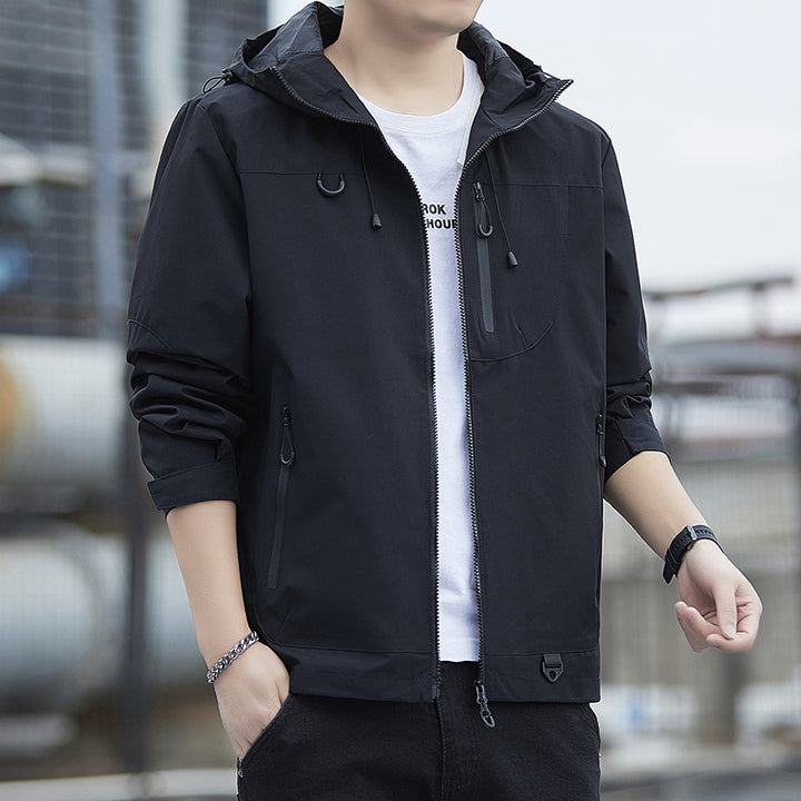 Men's lightweight Urban softshell hoodie jacket with contrasting zippers, chest pocket, and adjustable drawstring hem Mune Fashion