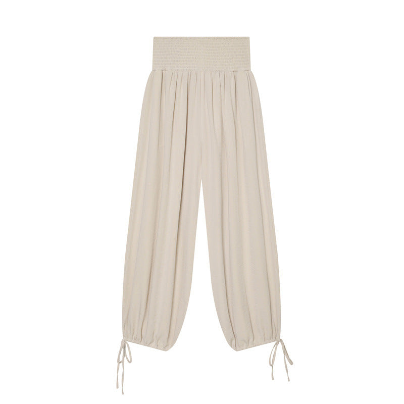 Women’s harem pants with high smock waistband, wide fall and adjustable cord closures Mune Fashion