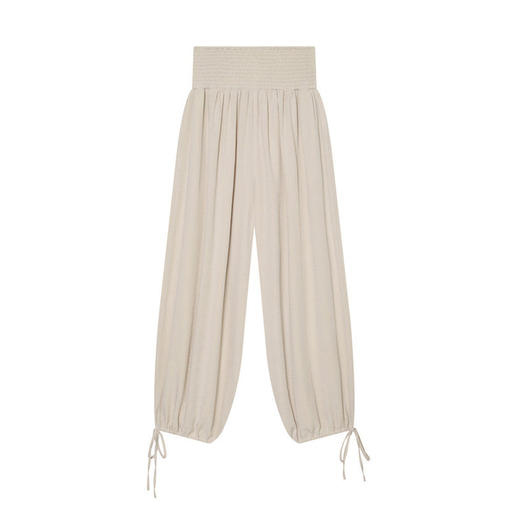 Women’s harem pants with high smock waistband, wide fall and adjustable cord closures Mune Fashion