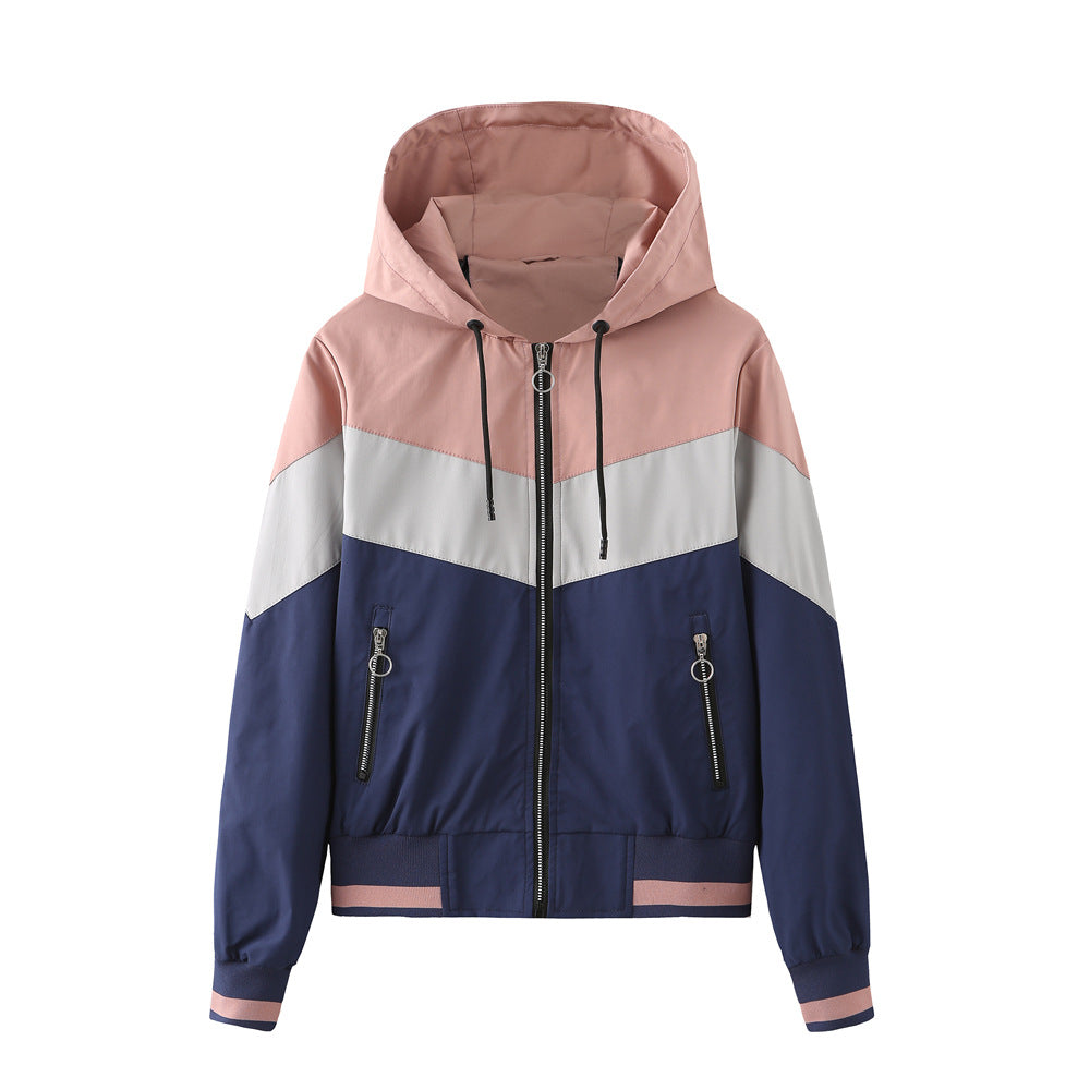 Women's lightweight windbreaker jacket with hood, block panel design, zippered pockets, and elastic hem Mune Fashion