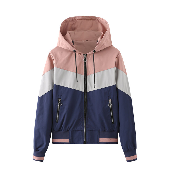 Women's lightweight windbreaker jacket with hood, block panel design, zippered pockets, and elastic hem Mune Fashion