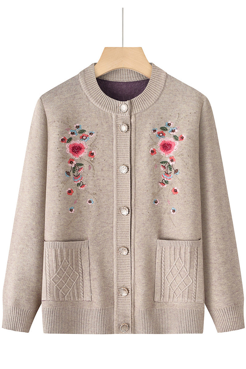 Women's embroidered cardigan with round neckline, decorative button placket, and patch pockets Mune Fashion