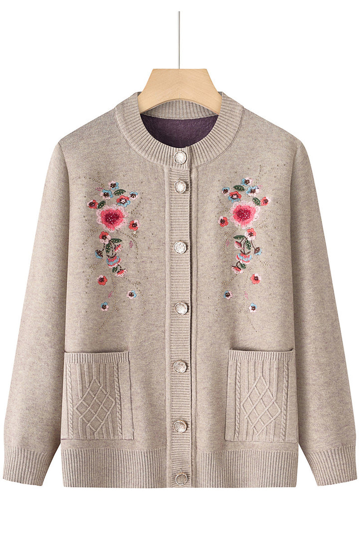 Women's embroidered cardigan with round neckline, decorative button placket, and patch pockets Mune Fashion