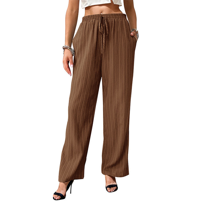 Women's loose summer trousers made from lightweight crinkle fabric with elastic waistband and drawstring.