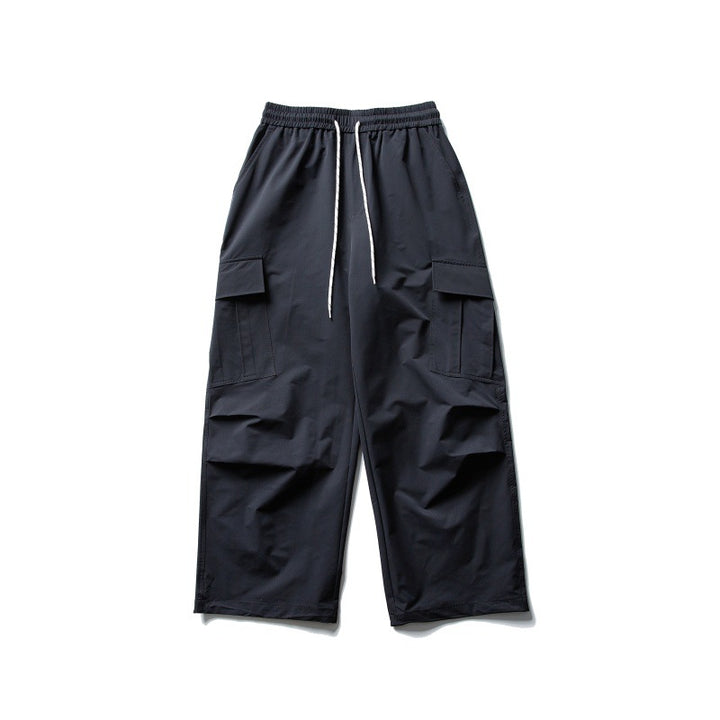 Unisex Wide Cargo Utility Pants in Baggy Cut with Elastic Drawstring Waist and Generous Flap Pockets
