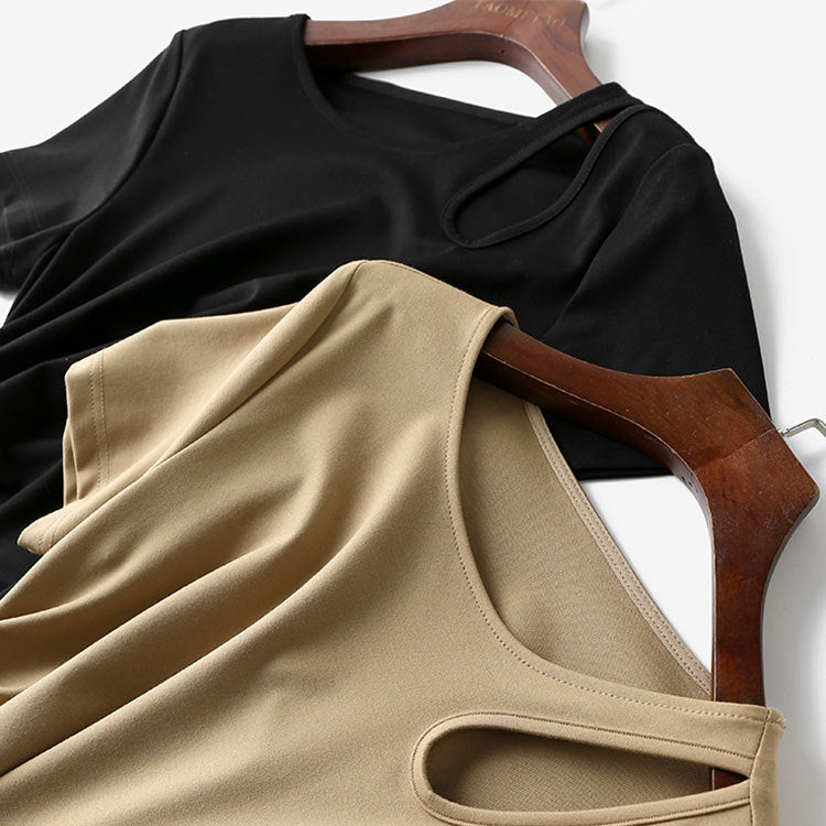 Women's maxi dress with asymmetric cut-out, side gathering, and flowing A-line.