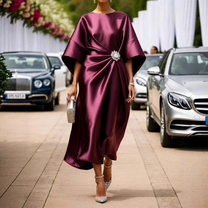 Women's elegant satin kaftan midi dress with kimono sleeves, side draping, and decorative brooch Mune Fashion