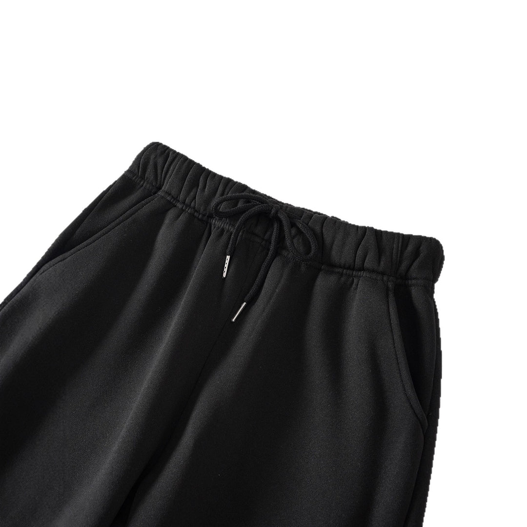 Women's high-cut joggers made of soft fleece cotton blend with elastic waistband, drawstring, and side pockets Mune Fashion