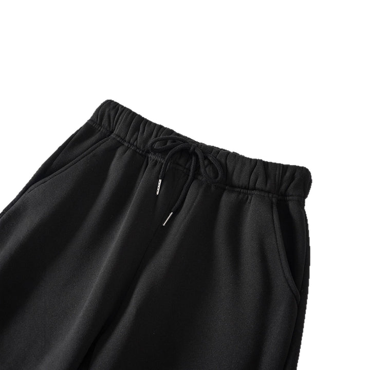 Women's high-cut joggers made of soft fleece cotton blend with elastic waistband, drawstring, and side pockets Mune Fashion