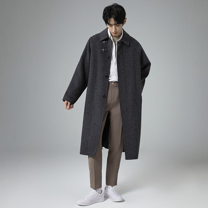 Men's floor-length wool blend coat in oversized cut with distinctive hook closures Mune Fashion