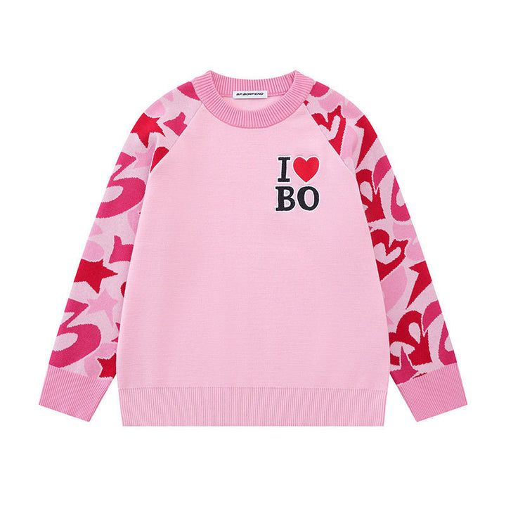 Women's knit sweater with raglan sleeves, statement jacquard sleeves, and ribbed hem Mune Fashion