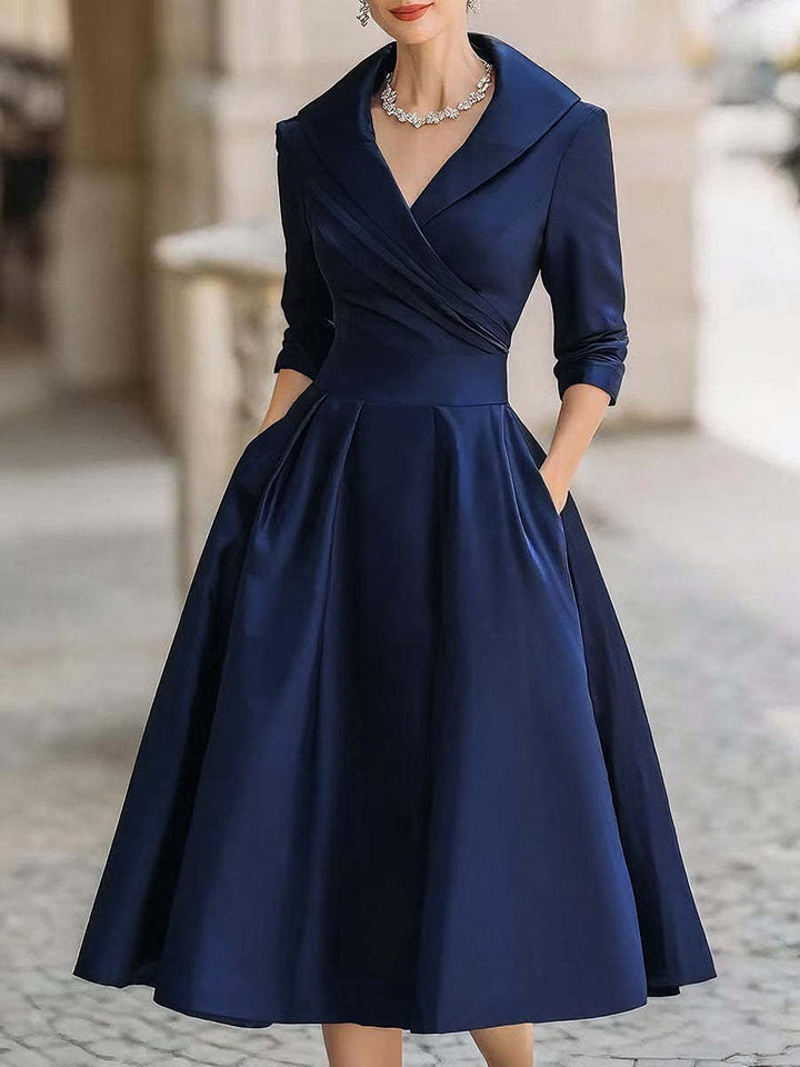 Women's elegant midi dress with wrap top, three-quarter sleeves, and side pockets Mune Fashion