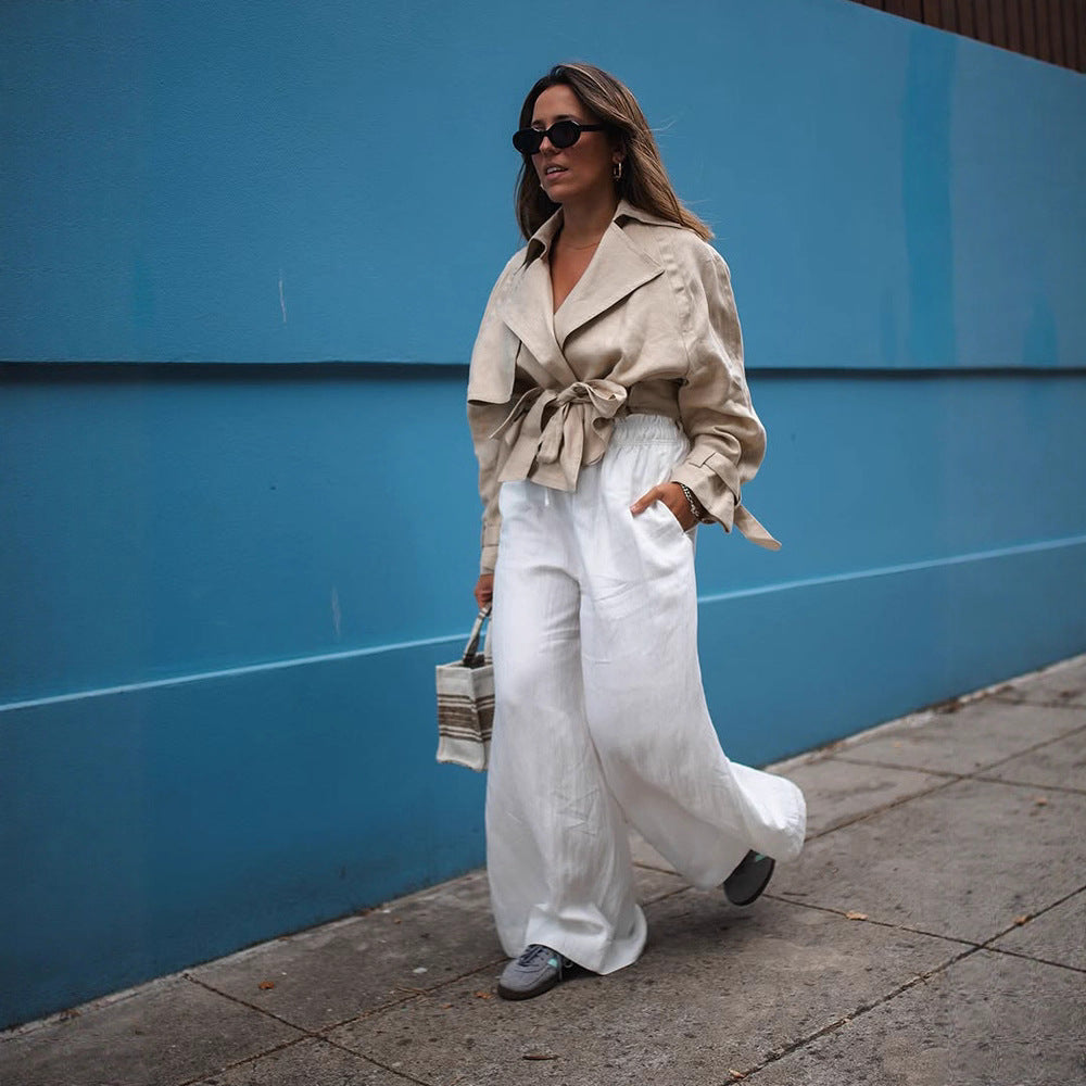 Women’s short trench coat with waist knot detail, cape sleeves, and boxy cropped cut Mune Fashion