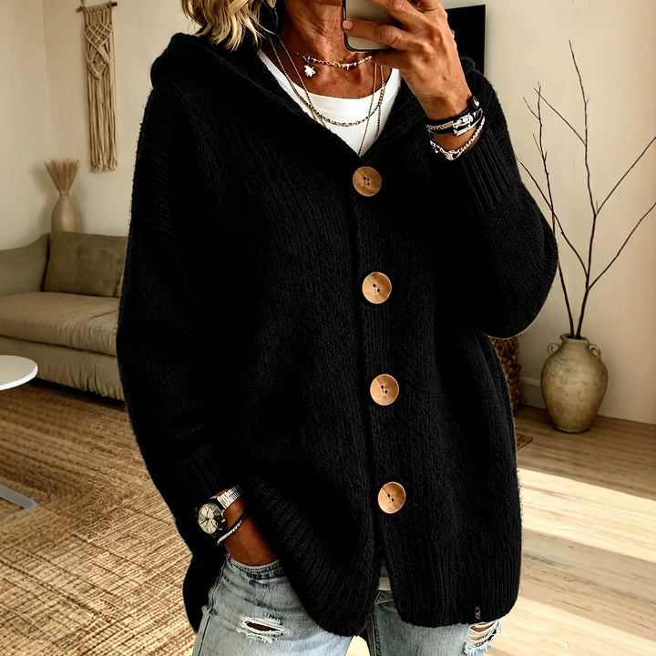 Women's chunky knit hooded cardigan with oversized silhouette, wooden button placket and ribbed cuffs Mune Fashion