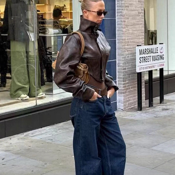 Women's short jacket made of faux leather with a high stand-up collar, shoulder flaps, and tailored silhouette Mune Fashion