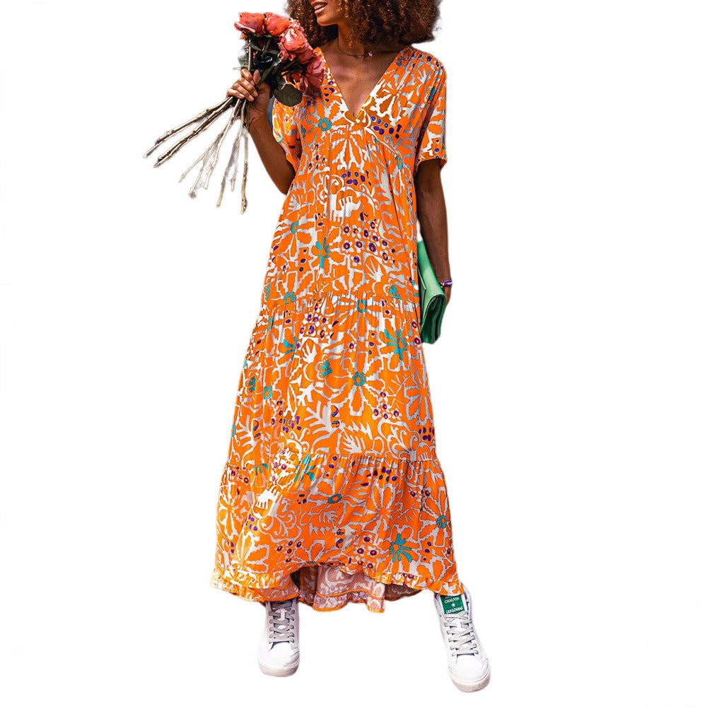 Women’s ankle-length V-neck maxi dress with graphic ethnic print, short sleeves and flared ruffle hem Mune Fashion