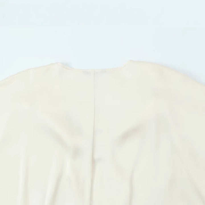 Women's satin blouse with deep wrap V-neck, elastic hem, and balloon sleeves Mune Fashion