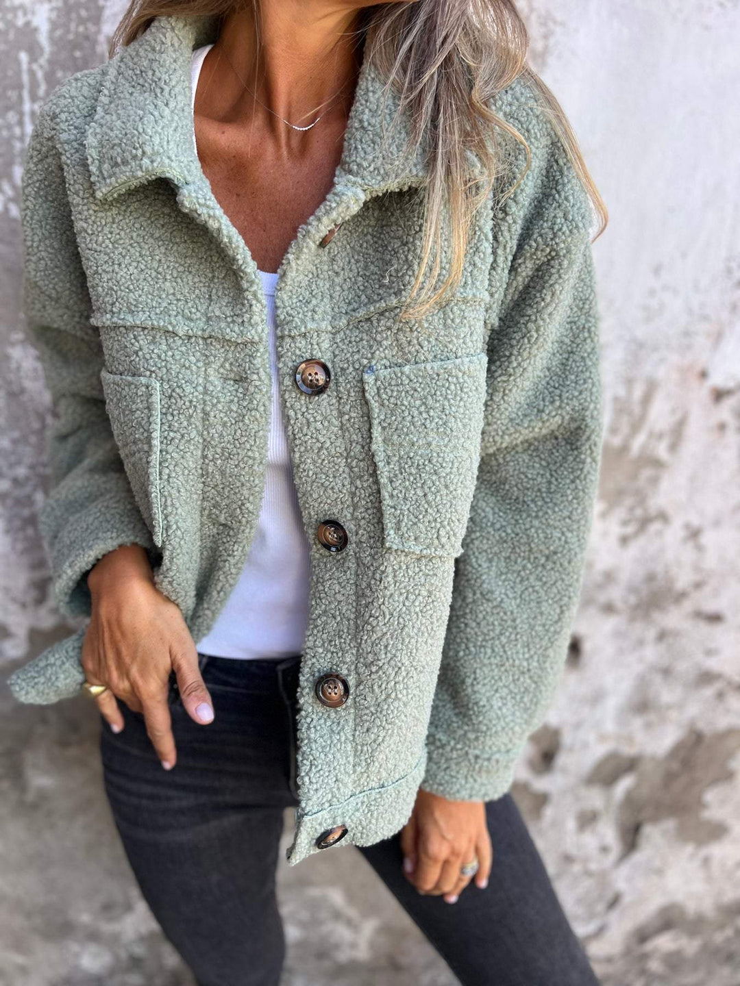 Ladies teddy jacket with large lapel collar, continuous button placket, and patch pockets Mune Fashion