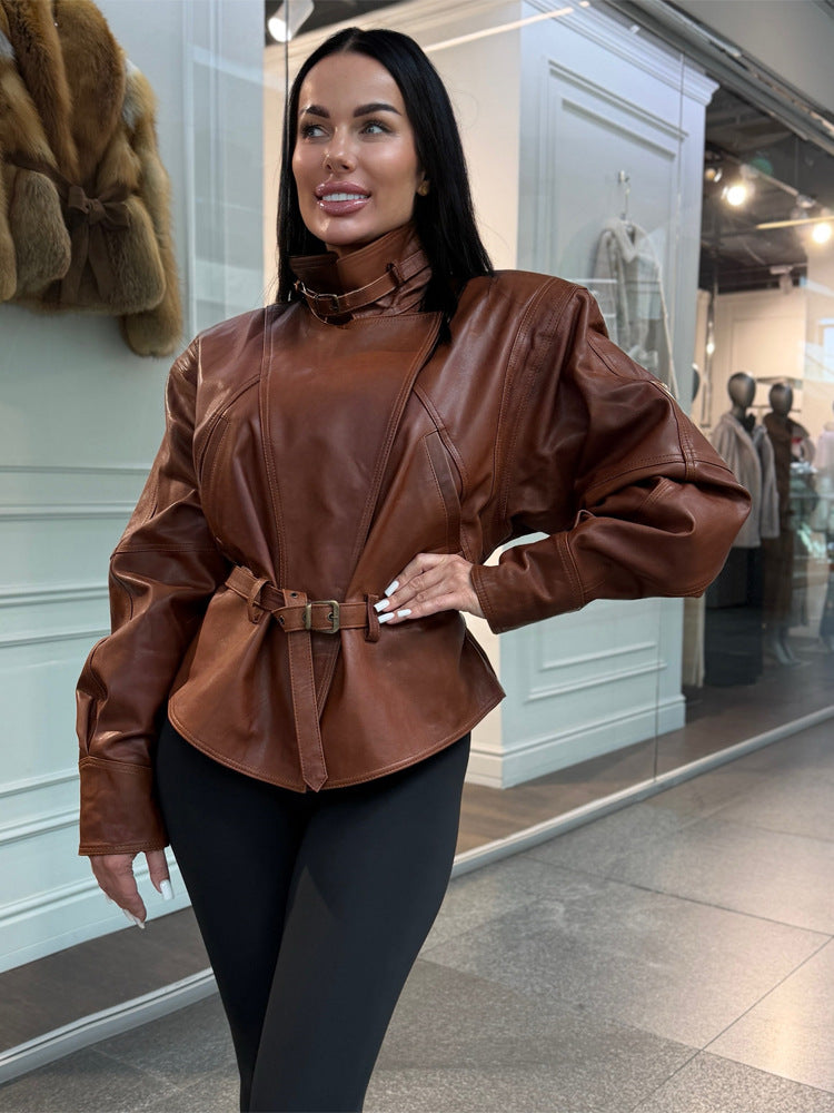 Women's tailored faux leather jacket with standing collar, neck strap, and figure-shaping waist belt Mune Fashion