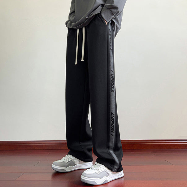 Men's sporty leisure pants with elastic waistband and side graphics