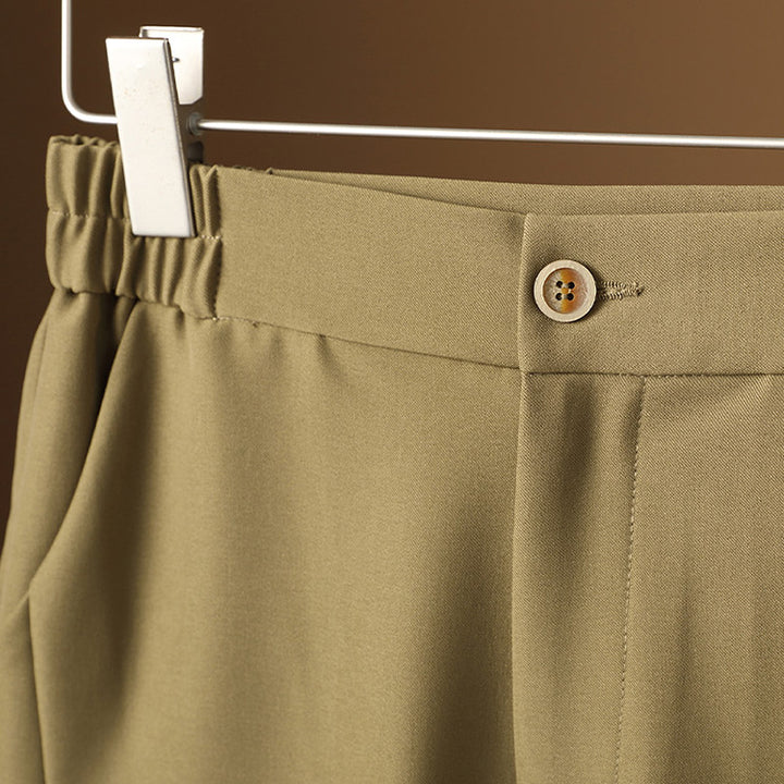 Women's high-waisted tapered suit trousers with elastic back waistband, crease & side pockets Mune Fashion
