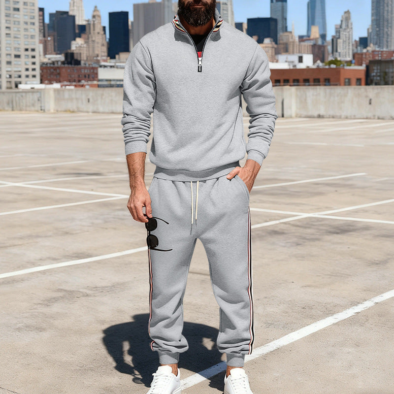 Men's stylish tracksuit set with half-zip, striped side stripes, and tapered jogger pants Mune Fashion