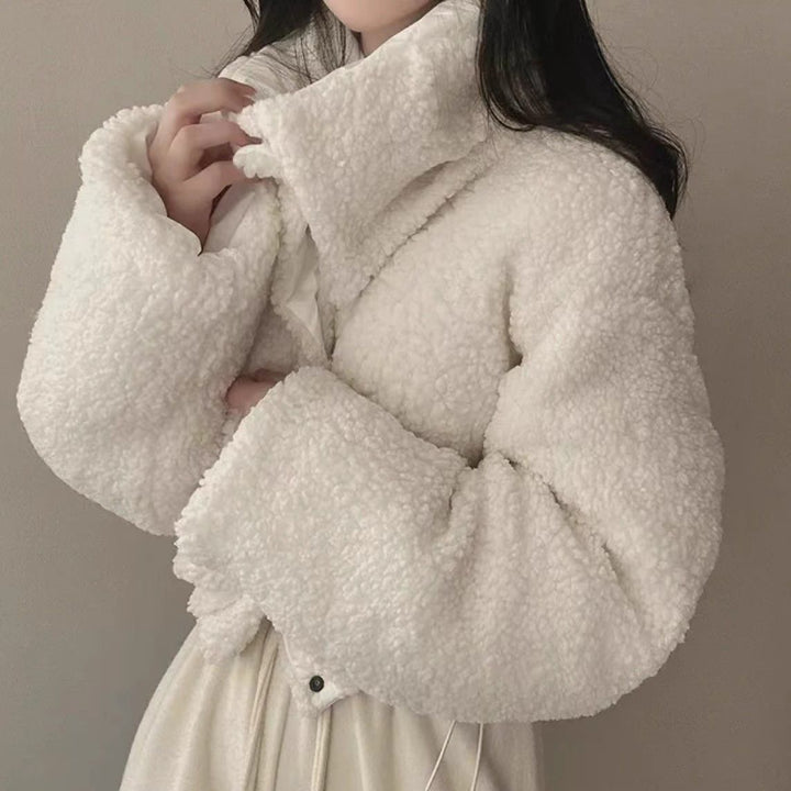 Women's short quilted puffer jacket with teddy collar, roll-up sleeves, and drawstring hem Mune Fashion