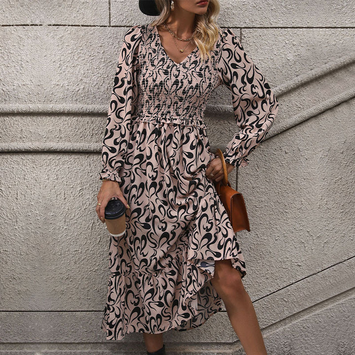 Women’s midi dress with elastic smock top, abstract all-over print and flared ruffle hem Mune Fashion