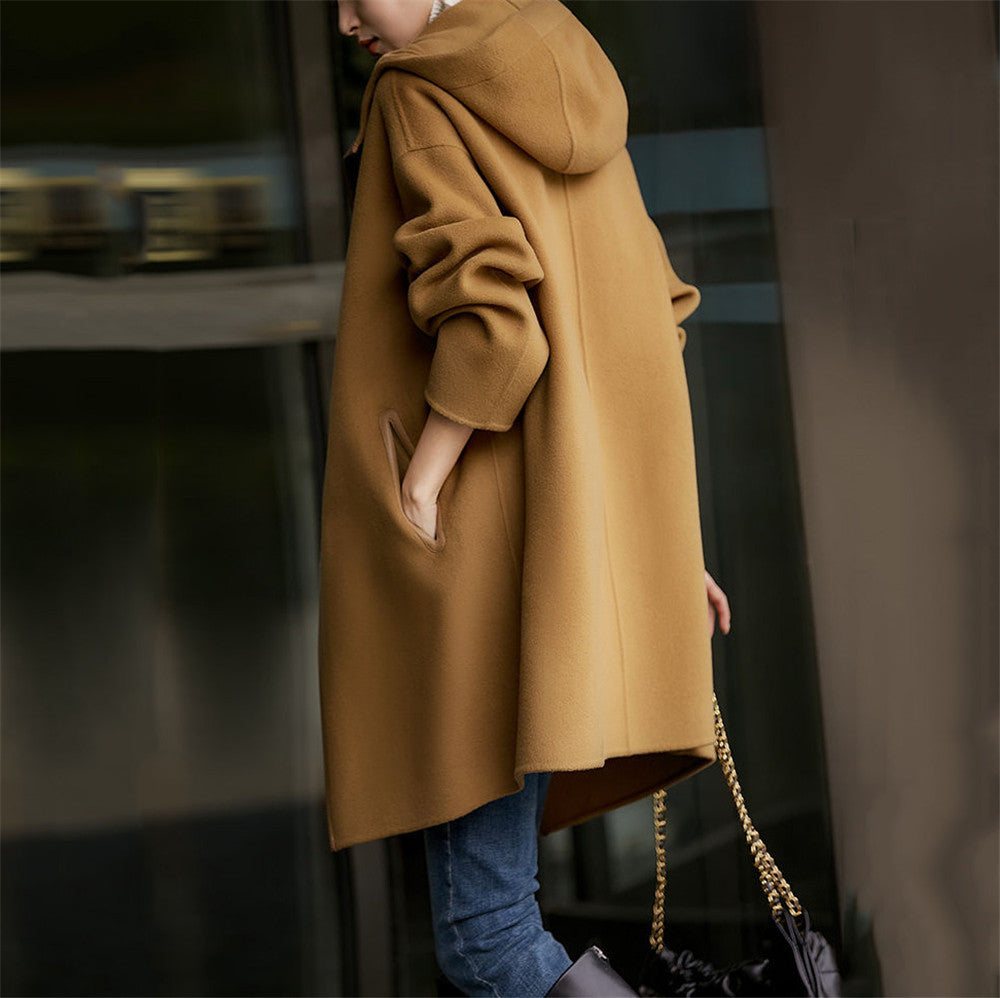 Women's mid-length wool blend coat with hood and snap button placket in oversized fit Mune Fashion