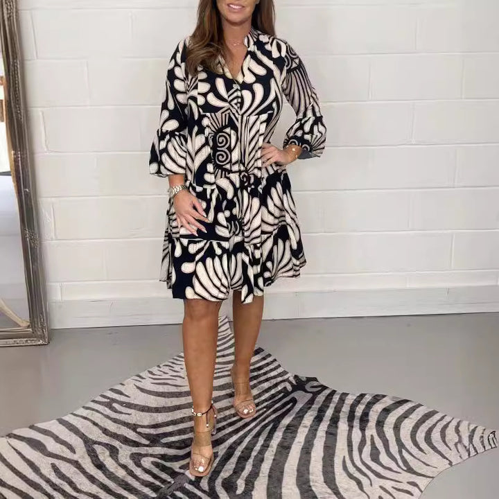 Women's tiered dress with large leaf print, V-neck and three-quarter sleeves Mune Fashion