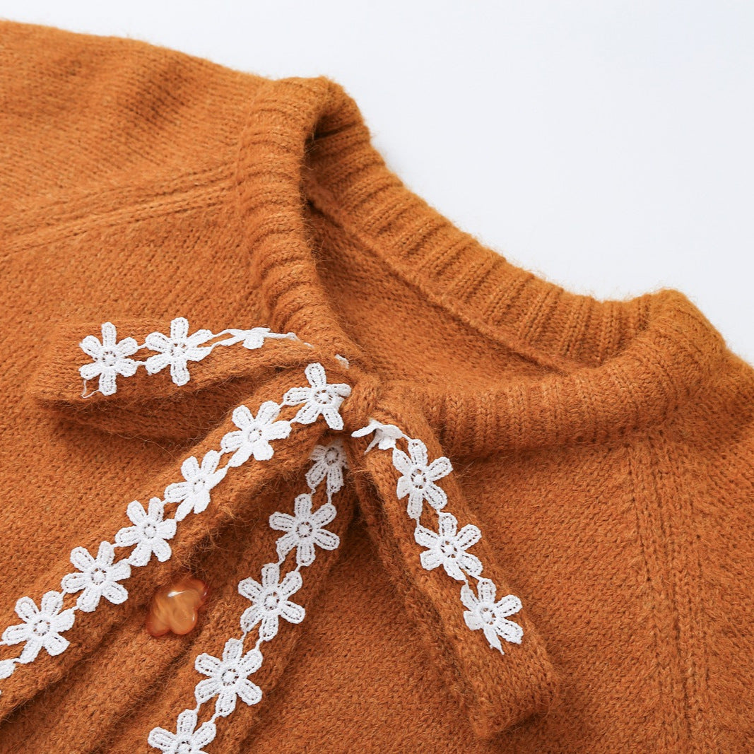 Women's chunky knit pullover with floral lace trim at the neckline Mune Fashion