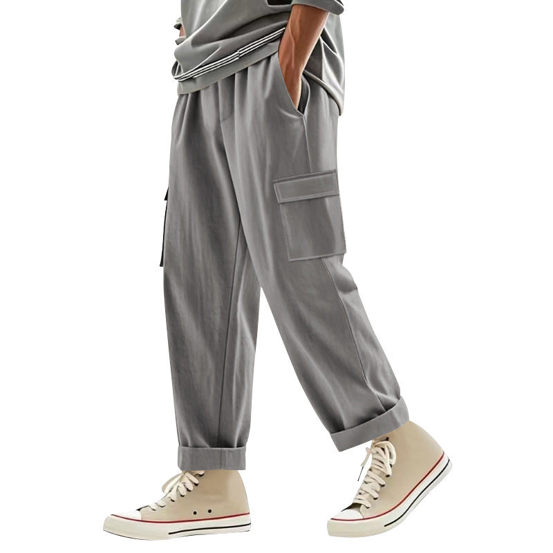 Men's wide cargo pants with flap pockets, elastic comfort waistband, and turned-up hem Mune Fashion