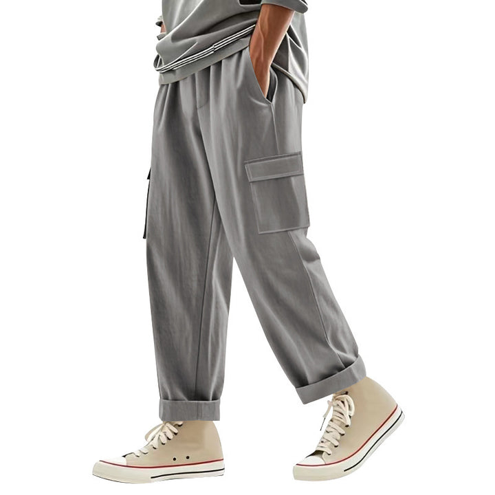 Men's wide cargo pants with flap pockets, elastic comfort waistband, and turned-up hem Mune Fashion