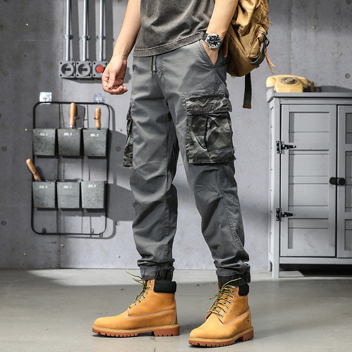 Men's outdoor cargo pants in jogger style with camouflage contrast, ergonomic knee darts, and elastic comfort waistband Mune Fashion