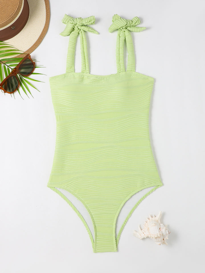 Women's figure-fitting one-piece swimsuit with playful bow details Mune Fashion