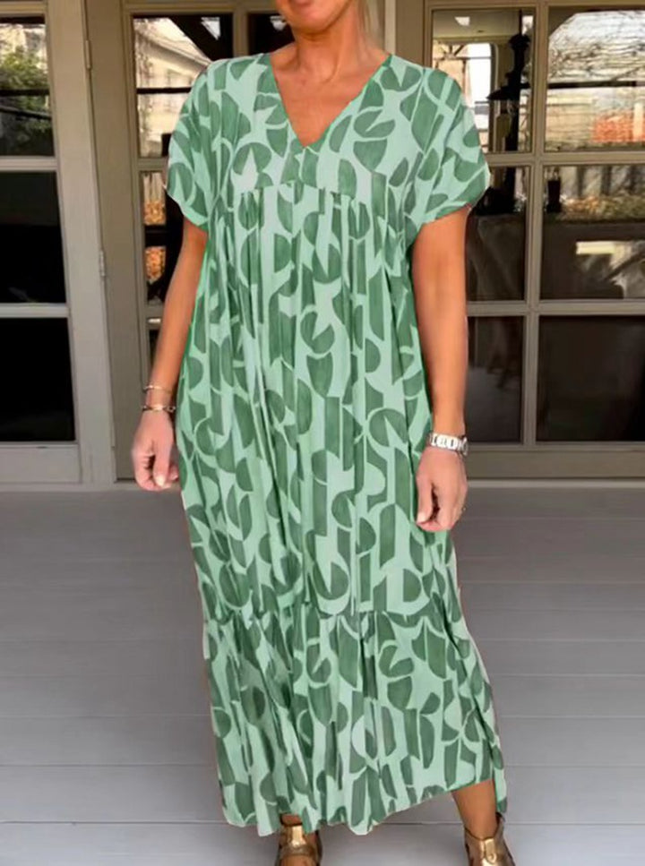 Women's voluminous maxi dress with under-bust seam, V-neck, short kimono sleeves, and tiered ruffle Mune Fashion