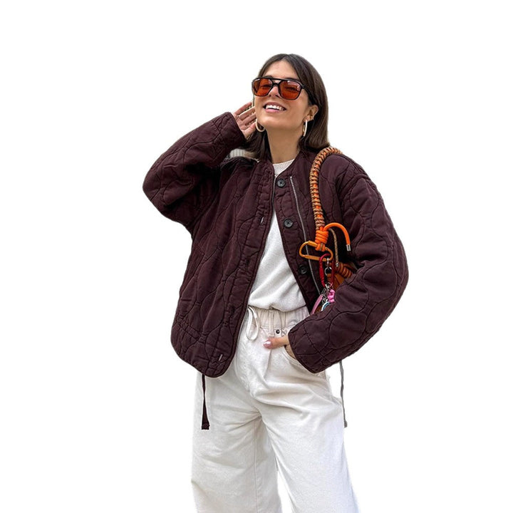 Women's shoulder bag made of synthetic leather with braided handle and spiral-shaped front grip Mune Fashion