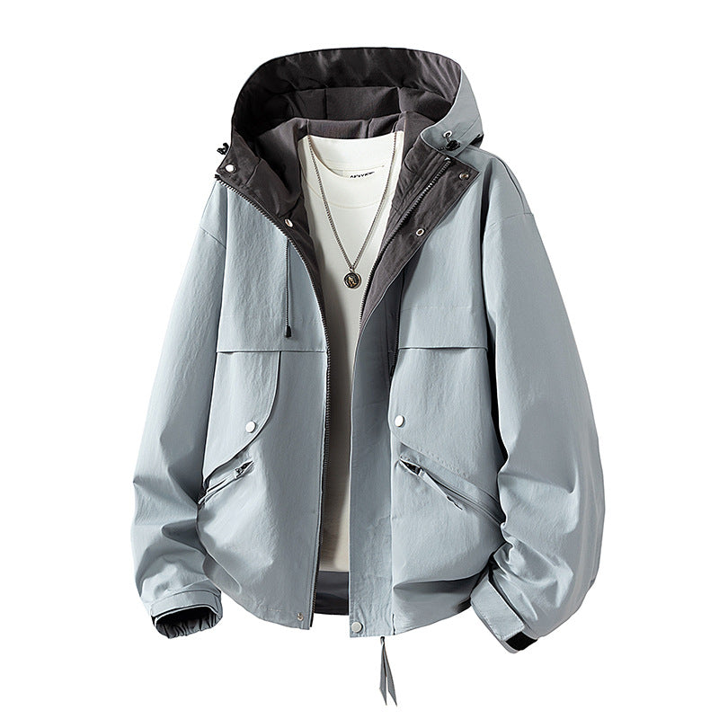 Unisex lightweight windproof transitional jacket with adjustable hood, drawstring, and zippered pockets Mune Fashion